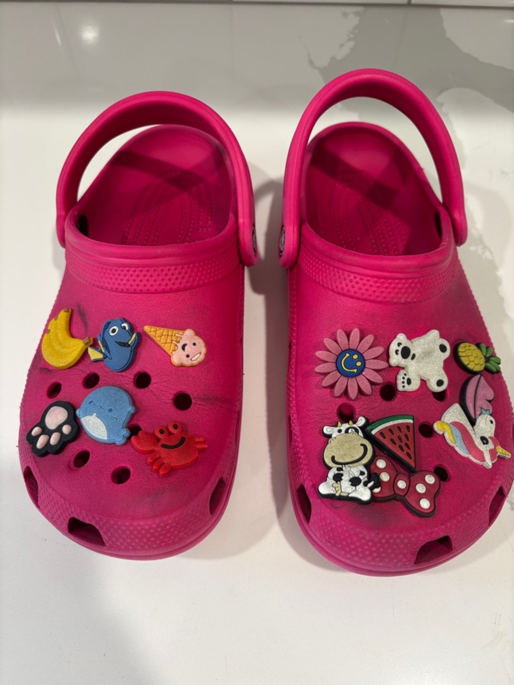 Crocs Bright Pink Clog Shoes with Decorative Charms included. Size 7 women’s